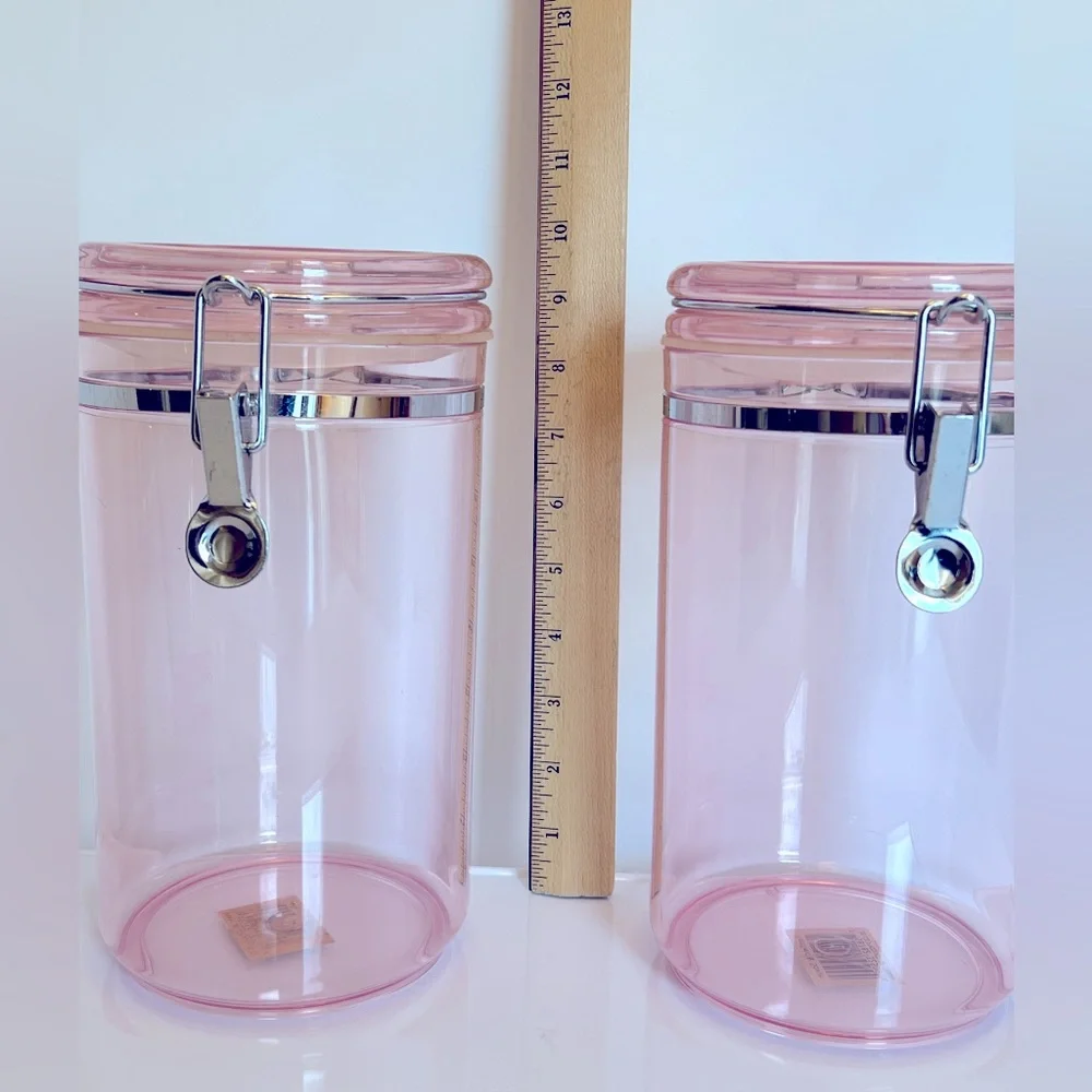 Two Vintage 85 Oz Pink Acrylic Airtight Jar Storage with Silver Clamp Closure.